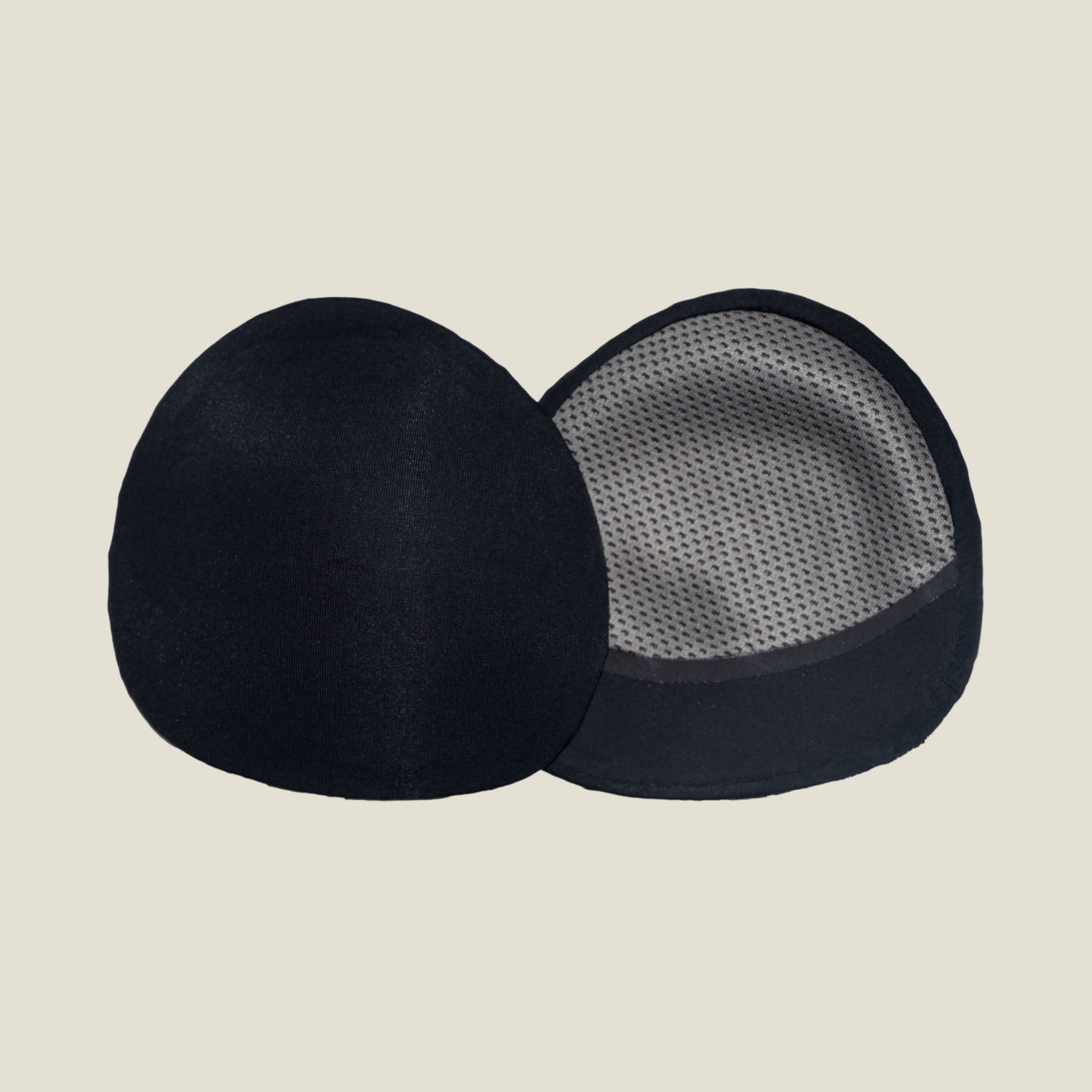 Pair of WUKA Maternity Contoured Nursing Pads showcasing inside and outside views for superior breastfeeding leak protection.