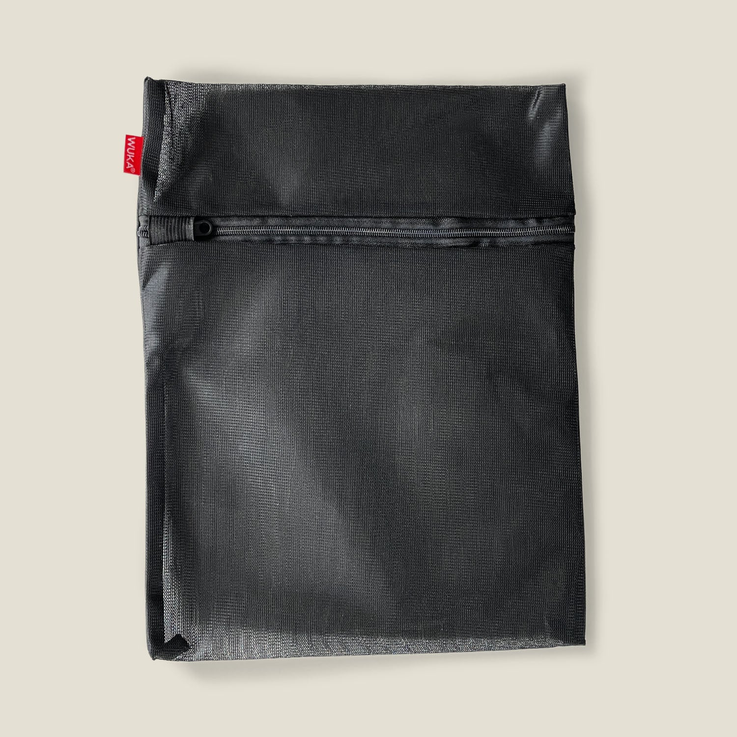 WUKA black mesh laundry bag with secure zipper, ideal for washing reusable period pants safely.