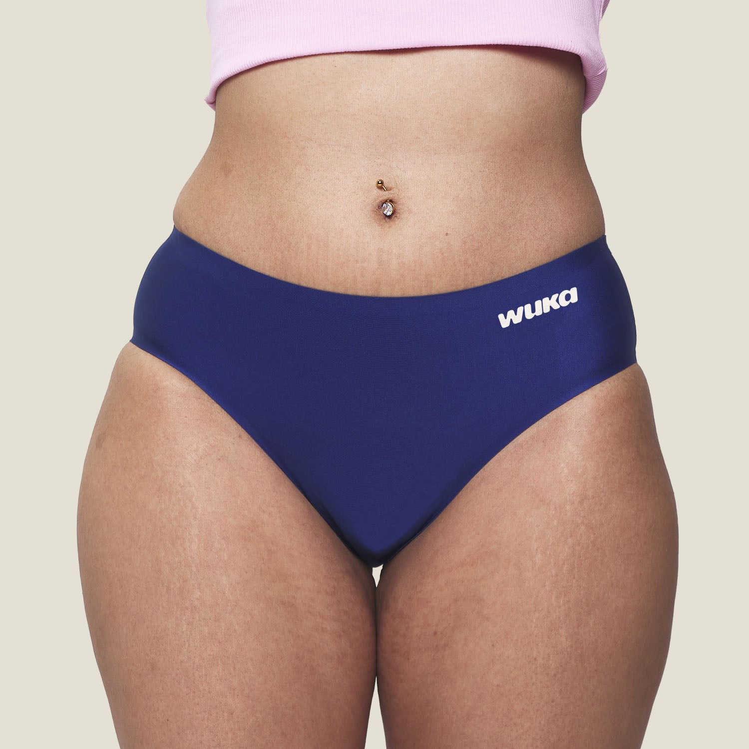 Close-up front view of WUKA Teen Stretch Seamless Period Pants in navy blue, showing comfortable fit and logo placement for heavy menstrual flow.