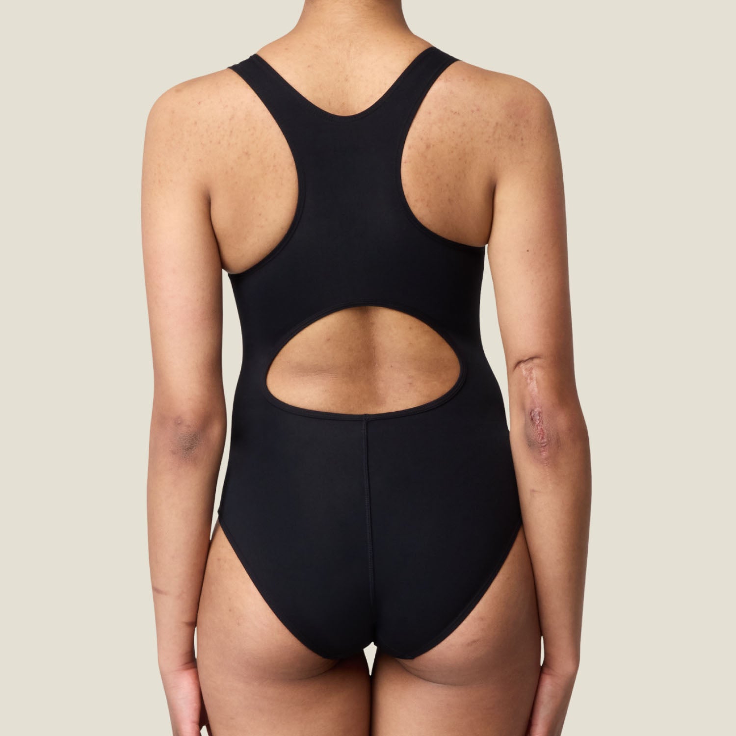 Back view of black period racerback swimsuit with keyhole cutout – secure and stylish swimwear for menstruation support