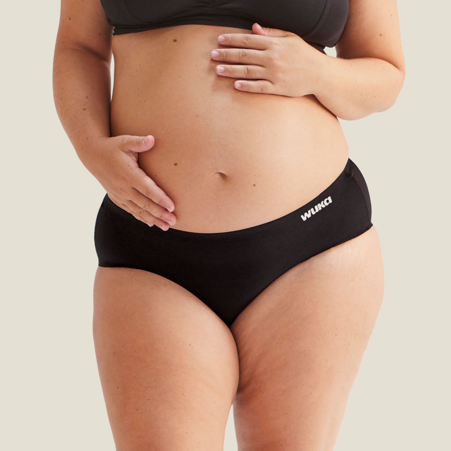 Close-up front view of WUKA Stretch™ High Waist Postpartum Period Pants, highlighting soft stretch fabric and secure fit.