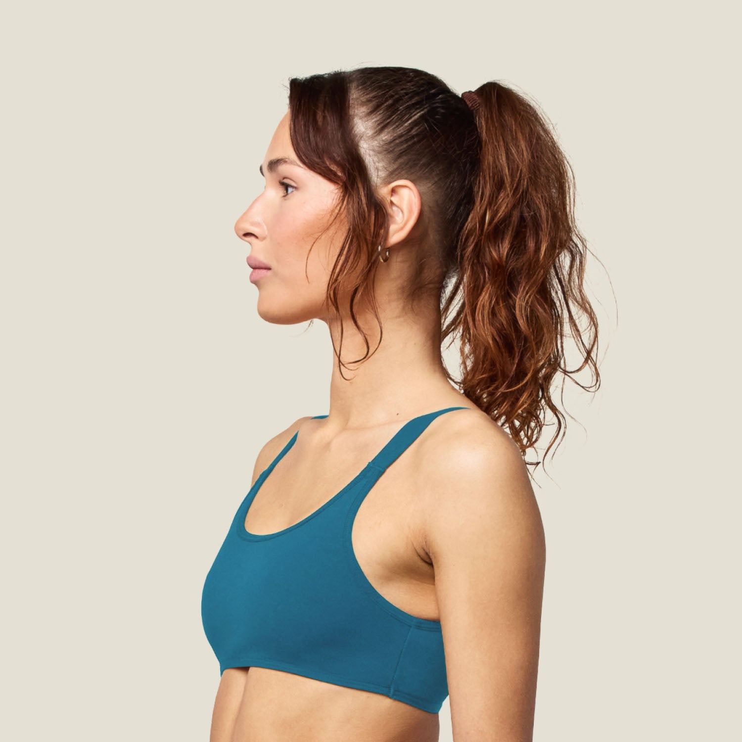 Teen Swim Bikini Top in Blue shown from the side, offering a profile look at the secure fit and minimal seams for comfort.