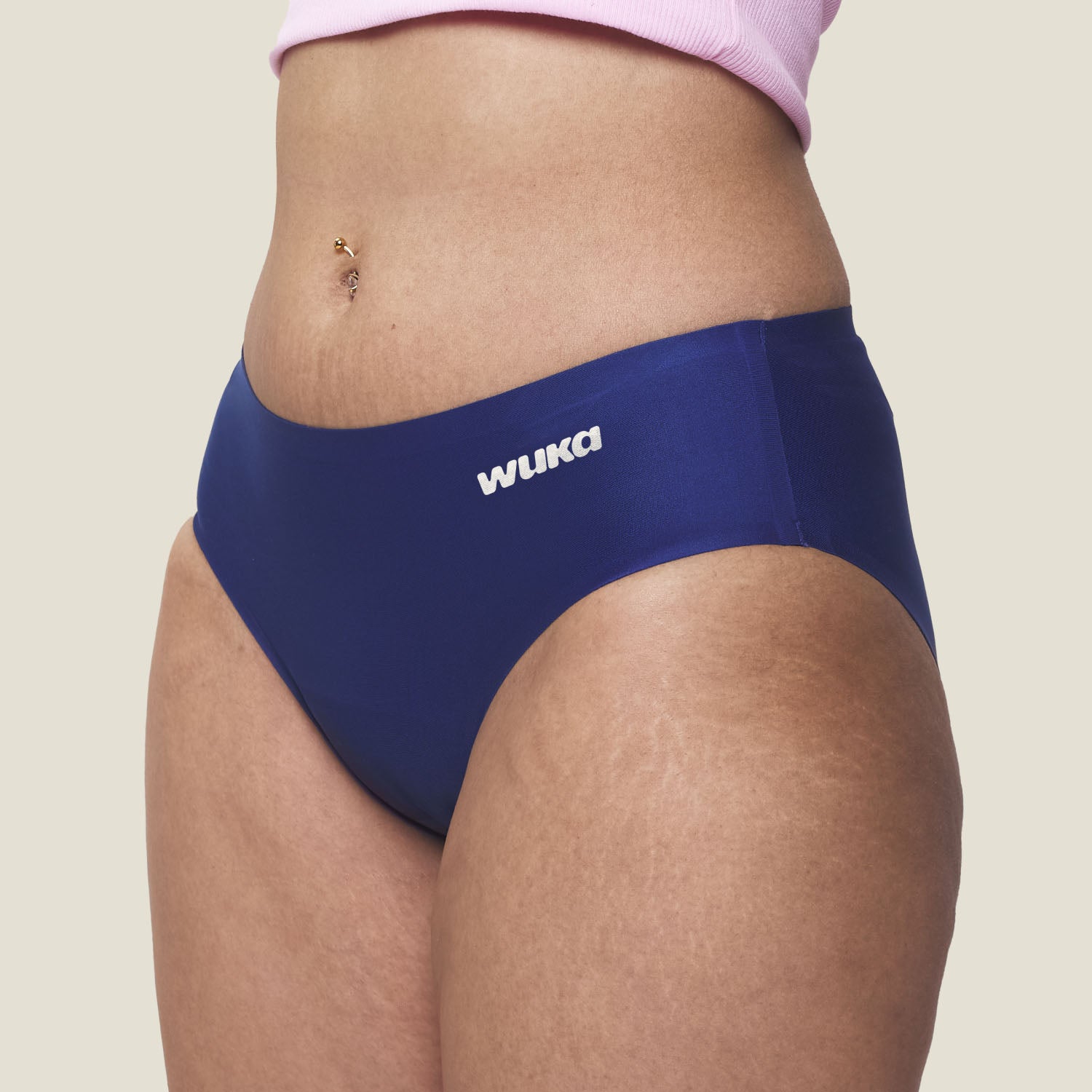 Side profile of WUKA Teen Stretch Seamless Period Underwear in blue for heavy flow, highlighting stretchable waistband and discreet design.