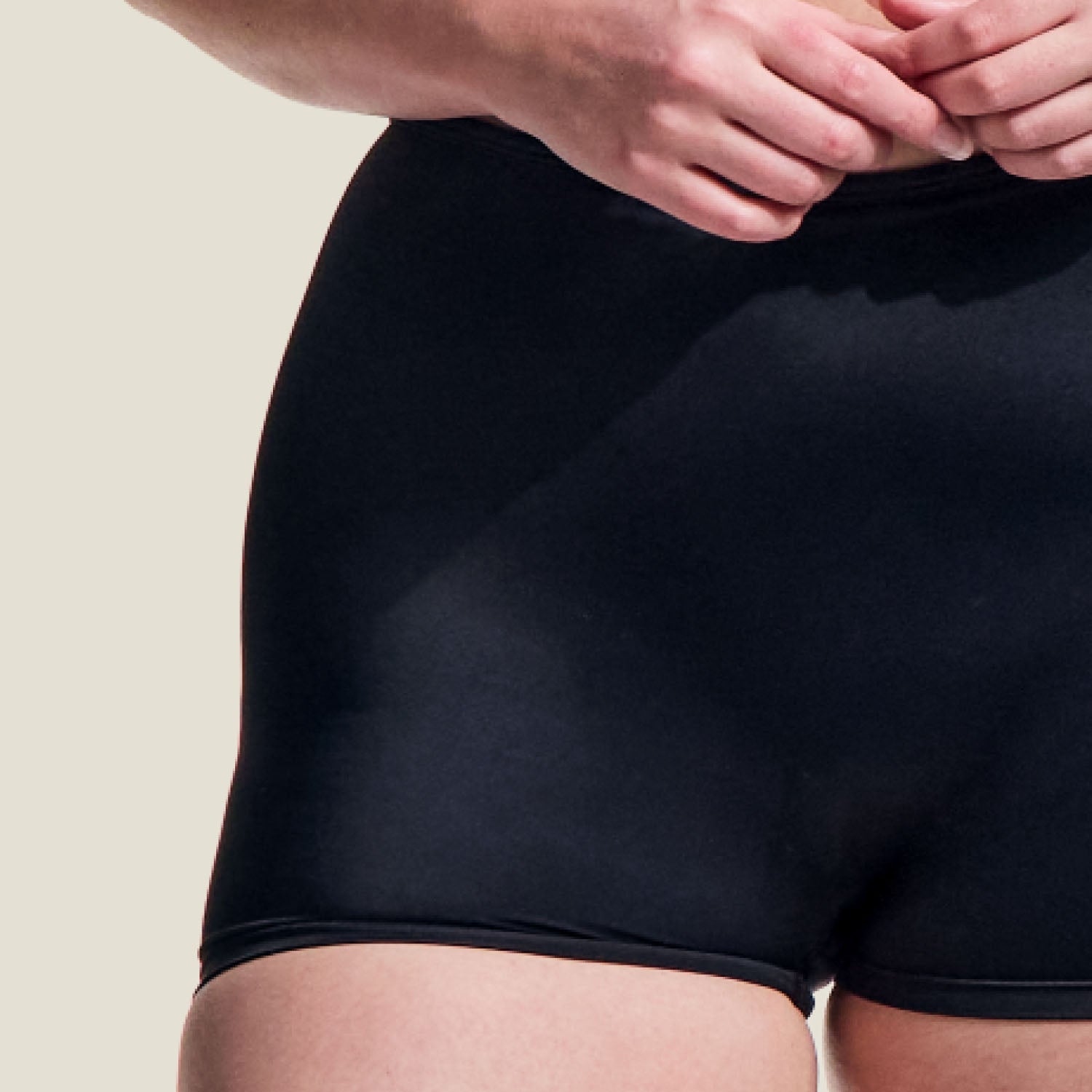 Detailed close-up of WUKA swim shorts fabric, showcasing stretchable, leak-proof, and smooth texture.